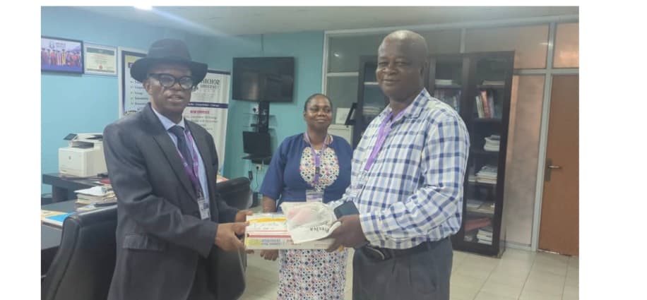 VC Prof. S. O. Bandele receives the donated magnetometer and radio antenna.