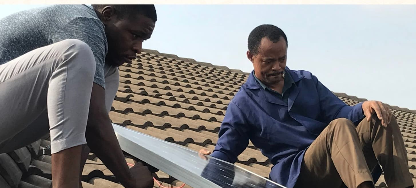 Installing solar panels on the Space Lab's roof.